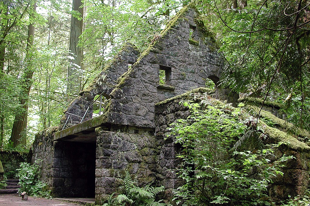 The Witch’s Castle in Portland’s Forest Park, a moss-covered stone ruin surrounded by ferns and trees.
