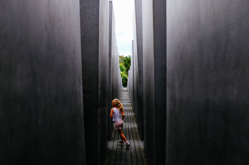 Kid exploring maze of grey walls